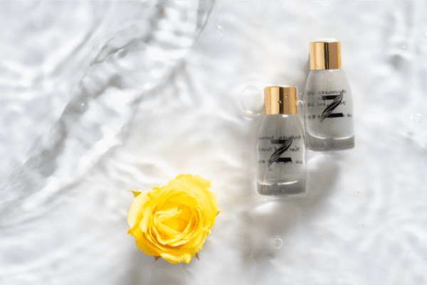 serum with flower on water background